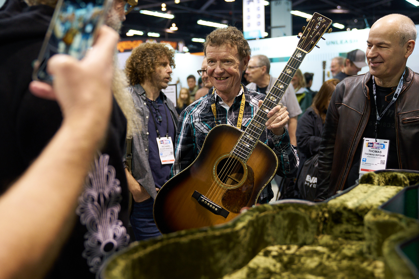 Chris Martin holding the guitar